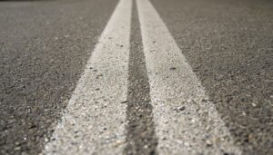 Striped etching marks on concrete caused by a narrow high pressure jet