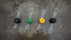 Pressure washer nozzles in different spray angles for cleaning concrete